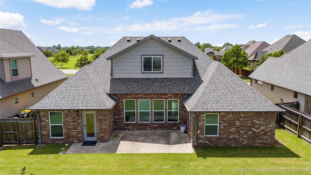 12913 S Ash St, Jenks, OK 74037 - rear view of house with brick siding, roof with shingles, a fenced backyard, and a patio area