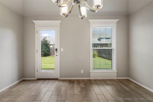 12913 S Ash St, Jenks, OK 74037 - doorway featuring a chandelier, healthy amount of natural light, and light wood-type flooring