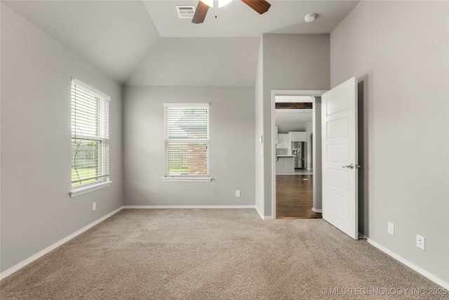 12913 S Ash St, Jenks, OK 74037 - unfurnished bedroom featuring carpet floors, vaulted ceiling, and ceiling fan