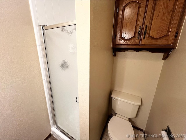 619 W 4th St, Skiatook, OK 74070 - bathroom with a stall shower and toilet