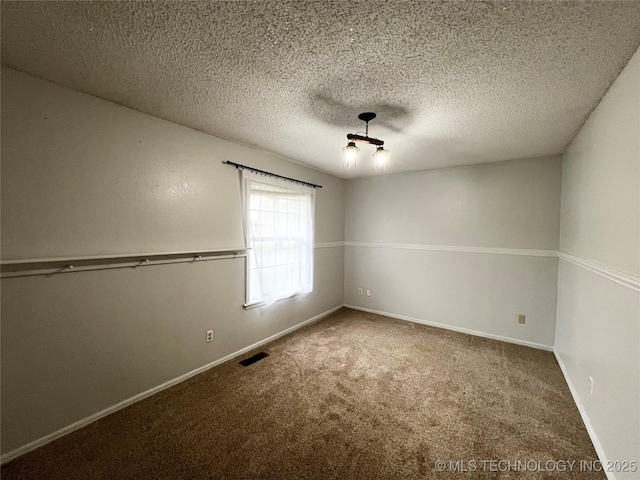 619 W 4th St, Skiatook, OK 74070 - carpeted spare room featuring baseboards and a textured ceiling