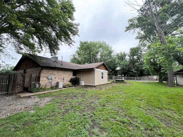 619 W 4th St, Skiatook, OK 74070 - back of property featuring brick siding