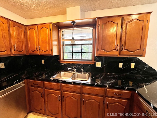 619 W 4th St, Skiatook, OK 74070 - kitchen featuring a textured ceiling, dark countertops, backsplash, brown cabinets, and dishwasher