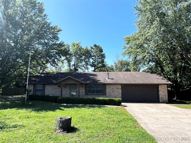 619 W 4th St, Skiatook, OK 74070 - ranch-style house featuring a garage, brick siding, driveway, and a front lawn