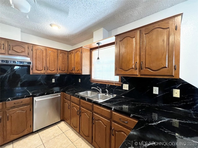 619 W 4th St, Skiatook, OK 74070 - kitchen featuring stainless steel dishwasher, backsplash, a textured ceiling, brown cabinets, and light tile patterned flooring