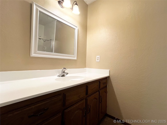 619 W 4th St, Skiatook, OK 74070 - bathroom with vanity and a textured wall