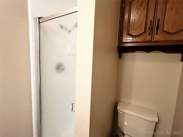 619 W 4th St, Skiatook, OK 74070 - bathroom with toilet and a stall shower