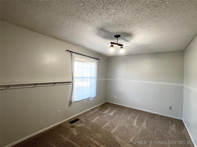 619 W 4th St, Skiatook, OK 74070 - carpeted spare room featuring a textured ceiling
