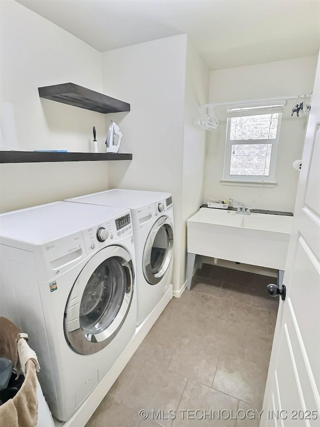 14603 E 114th St, Owasso, OK 74055 - laundry room featuring washer and dryer and light tile patterned flooring