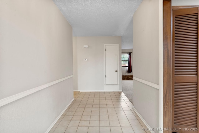 816 N Birch St, Jenks, OK 74037 - hall with a textured ceiling and light tile patterned flooring