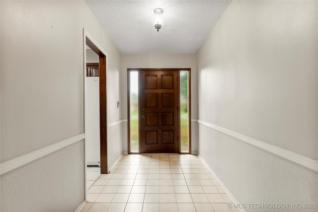 816 N Birch St, Jenks, OK 74037 - foyer with a textured ceiling and light tile patterned flooring