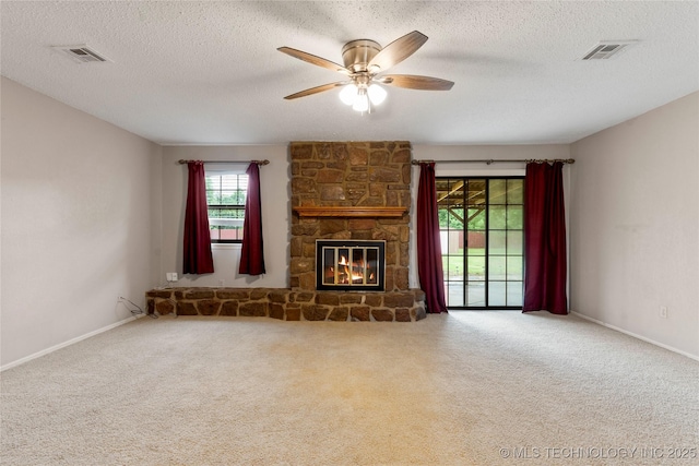 816 N Birch St, Jenks, OK 74037 - unfurnished living room with ceiling fan, carpet flooring, a fireplace, and a textured ceiling
