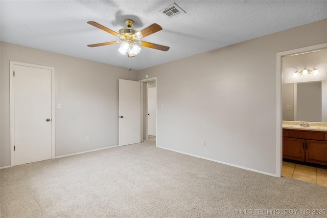816 N Birch St, Jenks, OK 74037 - unfurnished bedroom featuring light carpet, ensuite bathroom, and ceiling fan