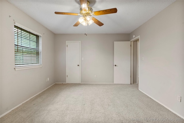 816 N Birch St, Jenks, OK 74037 - unfurnished room featuring ceiling fan, carpet floors, and a textured ceiling