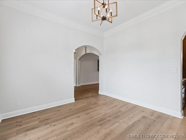 19345 S Fieldstone Dr E, Claremore, OK 74017 - unfurnished room with arched walkways, light wood finished floors, crown molding, and a chandelier