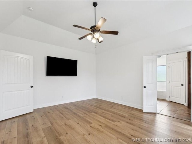 19345 S Fieldstone Dr E, Claremore, OK 74017 - spare room featuring light wood-style flooring, a ceiling fan, and lofted ceiling