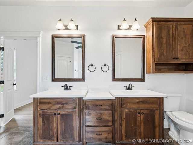 19345 S Fieldstone Dr E, Claremore, OK 74017 - full bathroom featuring double vanity and toilet