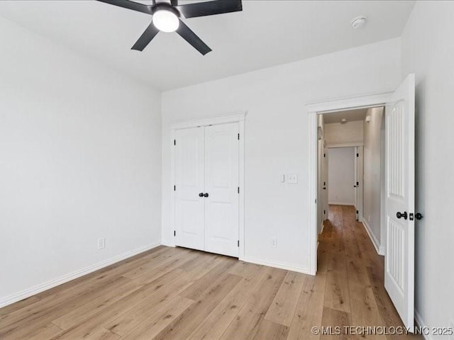 19345 S Fieldstone Dr E, Claremore, OK 74017 - unfurnished bedroom with light wood-type flooring, a closet, and a ceiling fan
