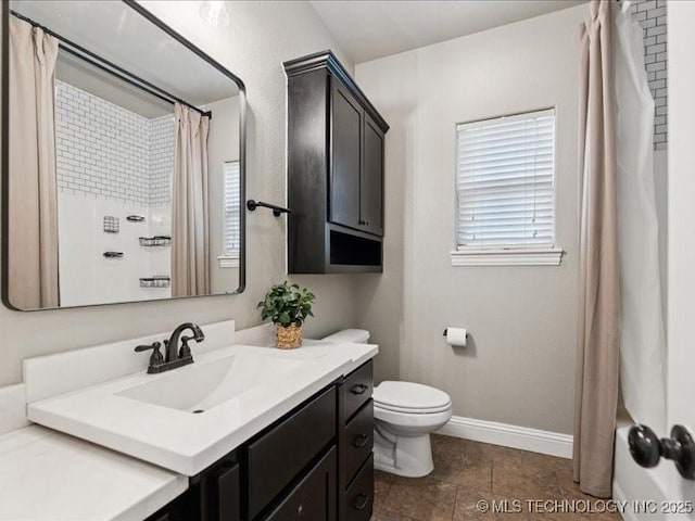 19345 S Fieldstone Dr E, Claremore, OK 74017 - bathroom with vanity, plenty of natural light, and shower / bath combo with shower curtain