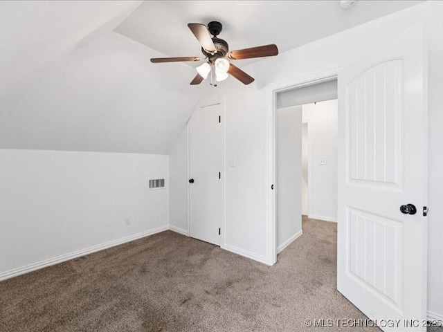 19345 S Fieldstone Dr E, Claremore, OK 74017 - additional living space with ceiling fan, vaulted ceiling, and carpet flooring