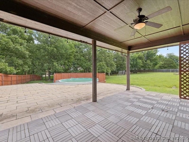 19345 S Fieldstone Dr E, Claremore, OK 74017 - fenced backyard with a patio, ceiling fan, and view of scattered trees