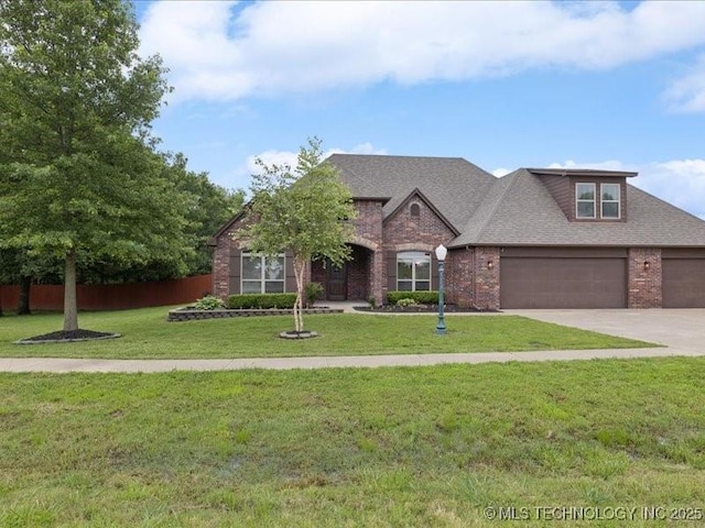 19345 S Fieldstone Dr E, Claremore, OK 74017 - view of front of home with brick siding, concrete driveway, a garage, and roof with shingles