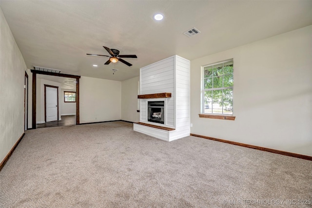 211 N 3rd St, Davis, OK 73030 - unfurnished living room featuring carpet floors, ceiling fan, a fireplace, and recessed lighting