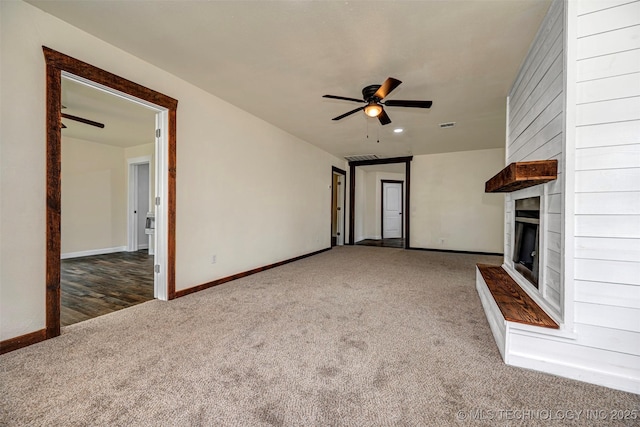 211 N 3rd St, Davis, OK 73030 - unfurnished living room with carpet, a large fireplace, ceiling fan, and recessed lighting