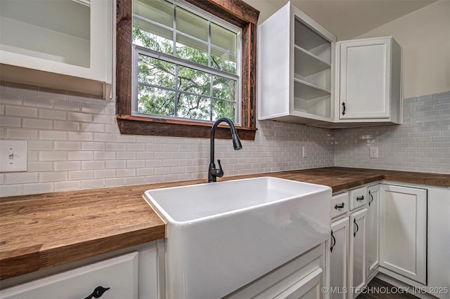 211 N 3rd St, Davis, OK 73030 - kitchen with wooden counters, backsplash, open shelves, white cabinets, and glass insert cabinets