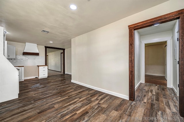 211 N 3rd St, Davis, OK 73030 - unfurnished living room with dark wood-type flooring and recessed lighting