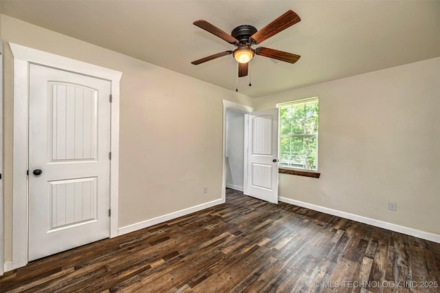 211 N 3rd St, Davis, OK 73030 - unfurnished bedroom featuring dark wood-style floors and a ceiling fan
