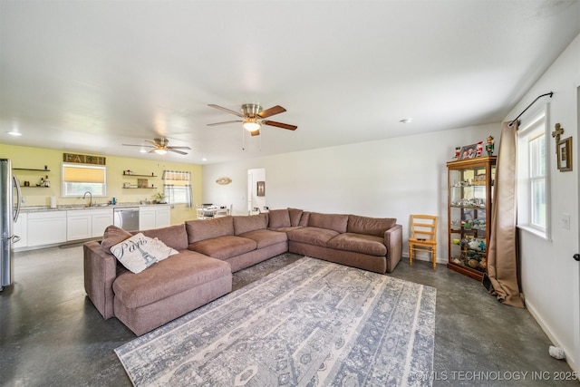 5499 S 4240th Rd, Chelsea, OK 74016 - living area featuring finished concrete floors and a ceiling fan