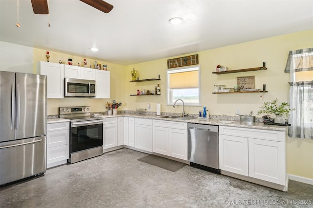 5499 S 4240th Rd, Chelsea, OK 74016 - kitchen featuring appliances with stainless steel finishes, open shelves, white cabinetry, ceiling fan, and recessed lighting