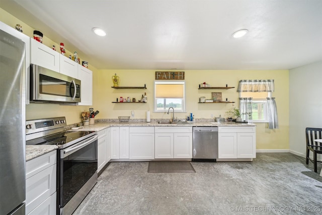 5499 S 4240th Rd, Chelsea, OK 74016 - kitchen featuring stainless steel appliances, open shelves, healthy amount of natural light, white cabinets, and recessed lighting