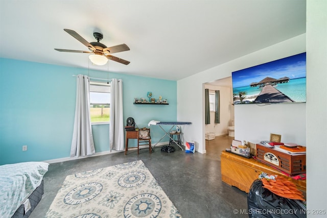 5499 S 4240th Rd, Chelsea, OK 74016 - bedroom with concrete flooring, ensuite bathroom, and ceiling fan