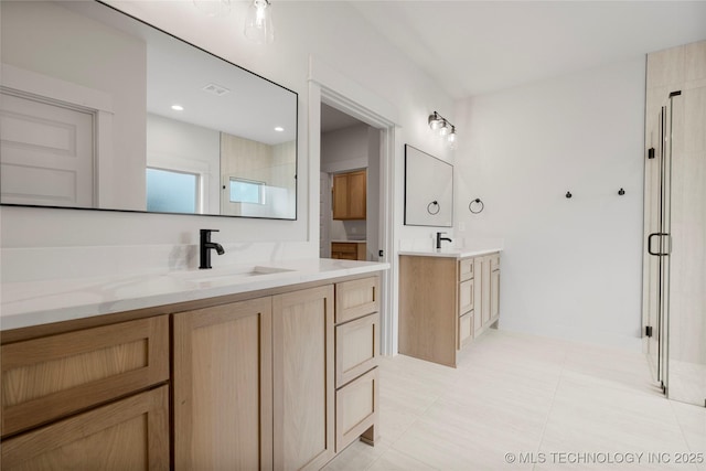 2048 E 128th Pl S, Jenks, OK 74037 - full bath featuring a shower stall, two vanities, and tile patterned floors