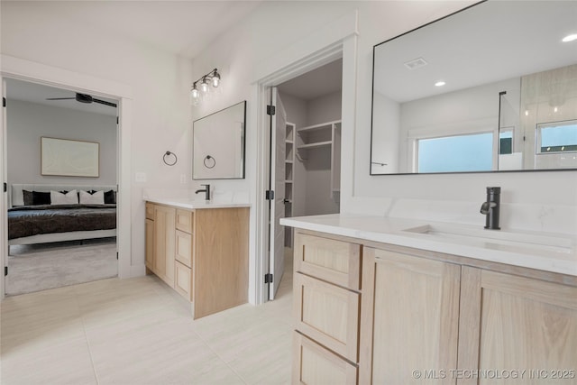 2048 E 128th Pl S, Jenks, OK 74037 - full bathroom featuring ensuite bath, two vanities, tile patterned floors, a ceiling fan, and recessed lighting