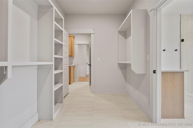 2048 E 128th Pl S, Jenks, OK 74037 - spacious closet with light tile patterned floors