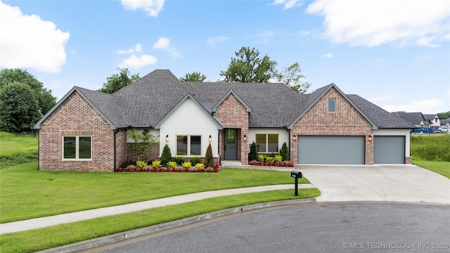 2048 E 128th Pl S, Jenks, OK 74037 - view of front of property with brick siding, an attached garage, concrete driveway, a front lawn, and a shingled roof