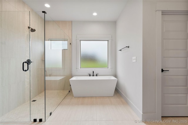 2048 E 128th Pl S, Jenks, OK 74037 - bathroom with a soaking tub, a stall shower, and recessed lighting