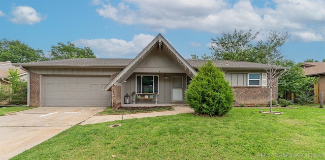 9667 E 27th St, Tulsa, OK 74129 - view of front facade featuring an attached garage, brick siding, driveway, and a front yard