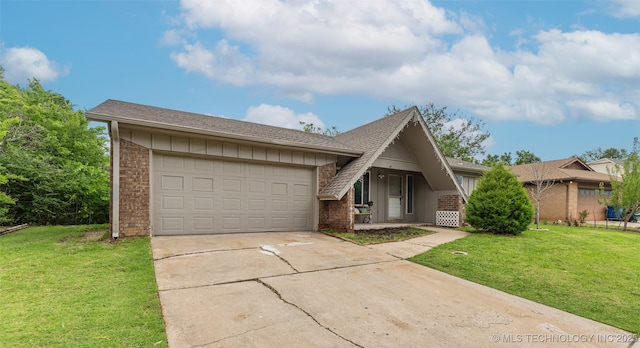 9667 E 27th St, Tulsa, OK 74129 - a-frame style home featuring driveway, a front yard, board and batten siding, and an attached garage