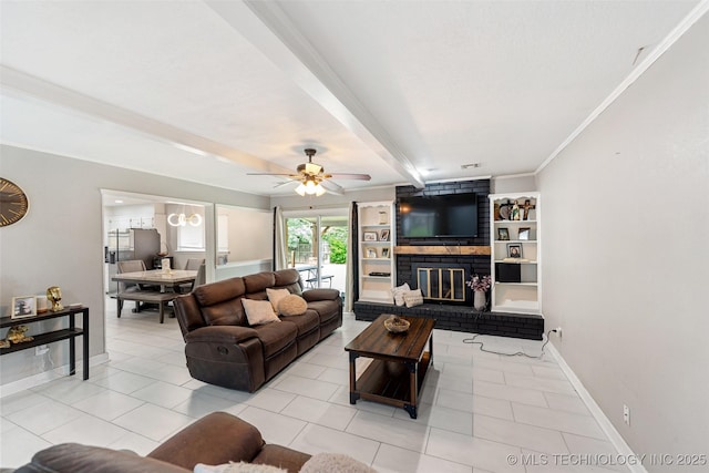 9667 E 27th St, Tulsa, OK 74129 - living area featuring light tile patterned floors, ceiling fan, a fireplace, beam ceiling, and ornamental molding