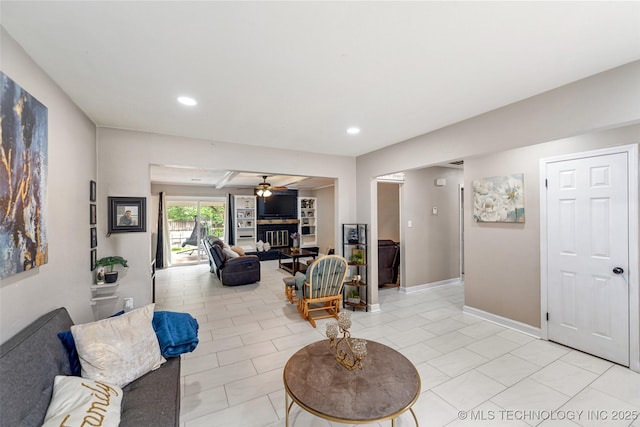 9667 E 27th St, Tulsa, OK 74129 - living room featuring a fireplace, a ceiling fan, recessed lighting, and light tile patterned floors