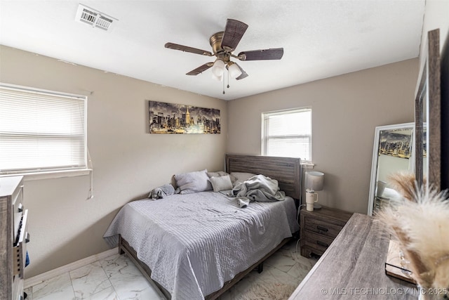 9667 E 27th St, Tulsa, OK 74129 - bedroom with light marble finish flooring and ceiling fan