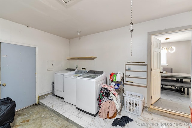 9667 E 27th St, Tulsa, OK 74129 - laundry room featuring separate washer and dryer and electric panel