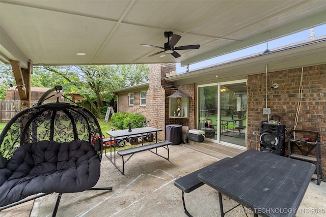 9667 E 27th St, Tulsa, OK 74129 - fenced backyard with outdoor dining area, a patio, and a ceiling fan
