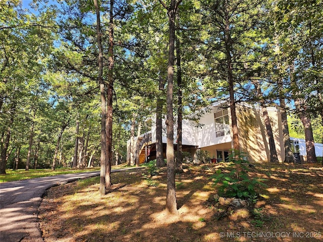 2417 Wilson St, Durant, OK 74701 - view of property exterior with stairway and driveway