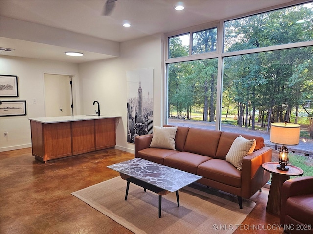 2417 Wilson St, Durant, OK 74701 - living room with concrete flooring and recessed lighting