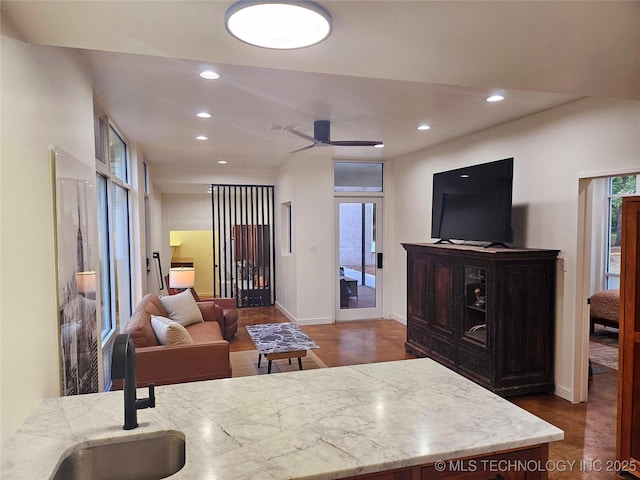 2417 Wilson St, Durant, OK 74701 - living area with recessed lighting, a ceiling fan, and dark wood-style flooring